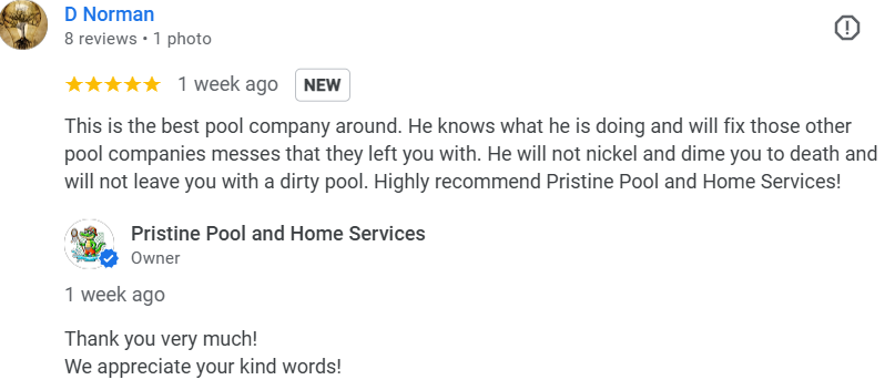 A beautiful swimming pool surrounded by a well-maintained backyard, showcasing a relaxing outdoor space.